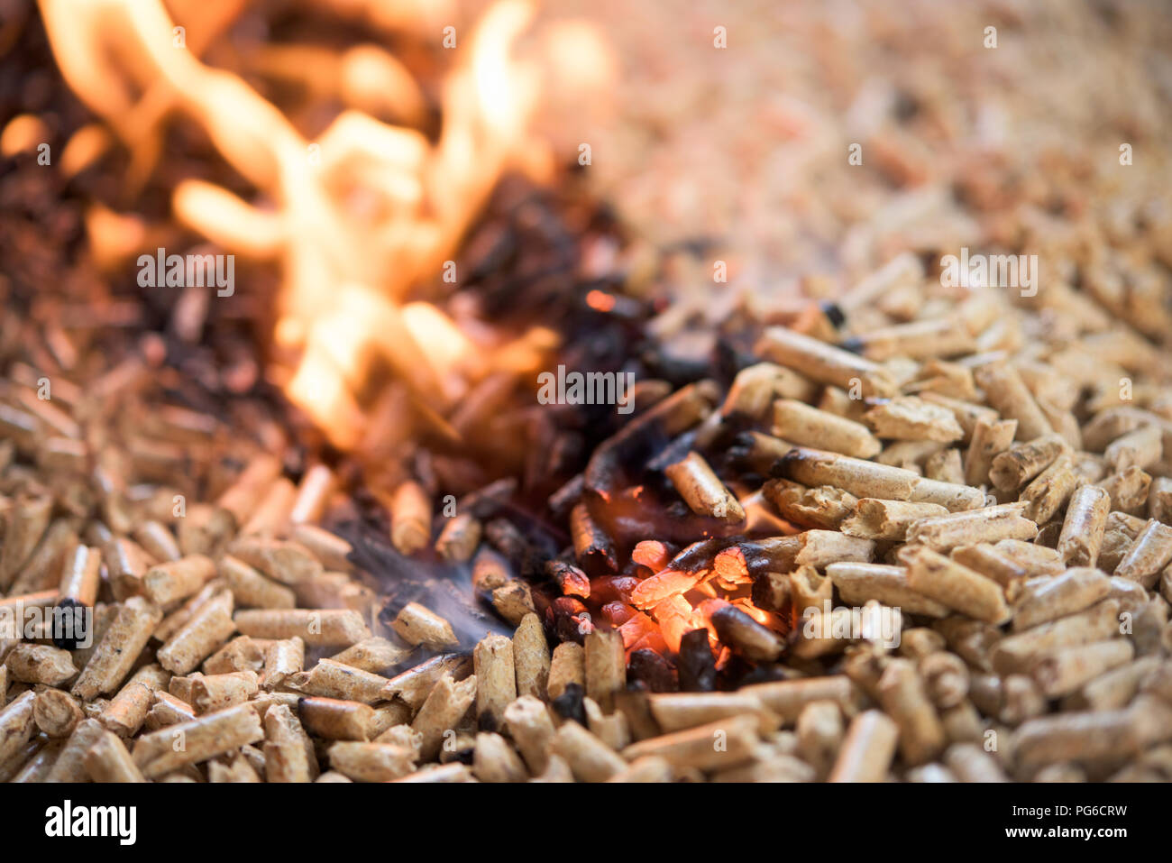 Pile of burning beech pellets - heating Stock Photo