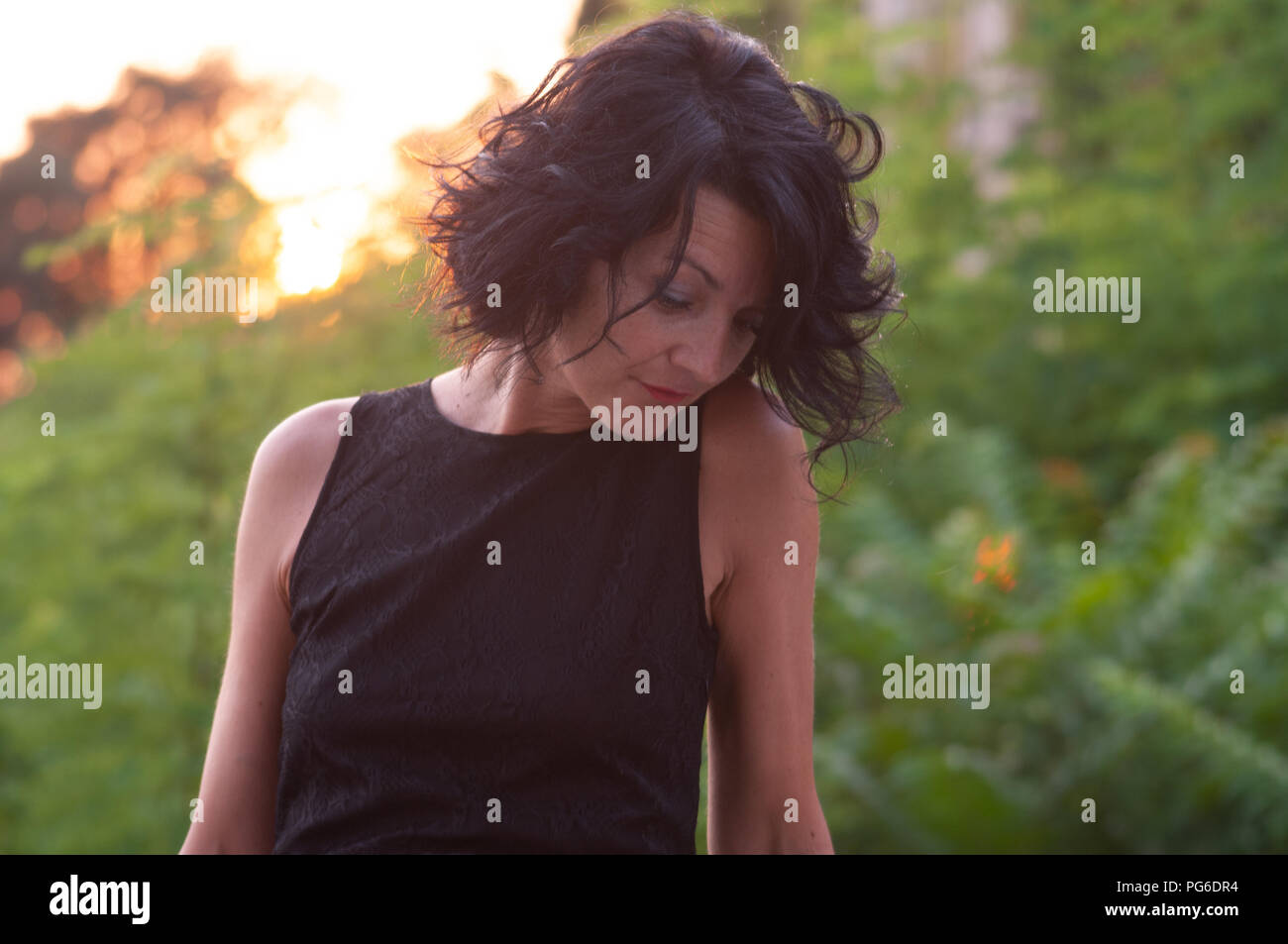Half Length Portrait Of A Lady With A Black Dress And Short Wavy