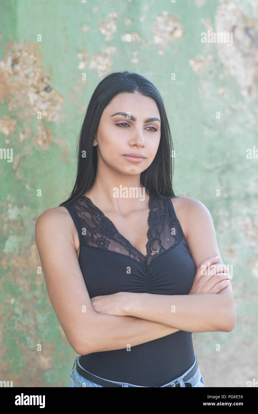 Sad woman arms folded looking hi-res stock photography and images - Alamy