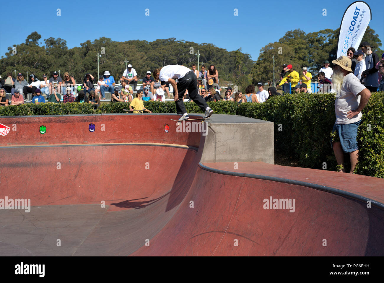 Skateboarding sport in Australia, Coffs Harbour on 18 August 2018. Boy skateboarder showing his skills while spectators watch. Stock Photo