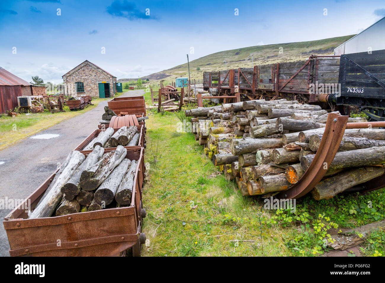 Rotting wooden railway wagons and pit props once used at Big Pit - a former coal mine now a UNESCO World Heritage Site in Blaenavon, Gwent, Wales, UK Stock Photo