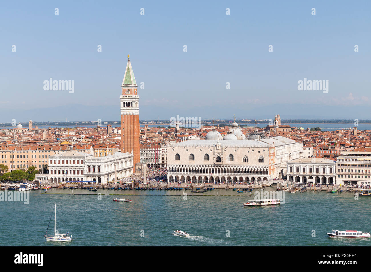 Aerial cityscape of San Marco, Venice, Veneto, Italy with the Doges Palace, Campanile, Marciana Library, Piazza San Marco, boat traffic in the lagoon Stock Photo