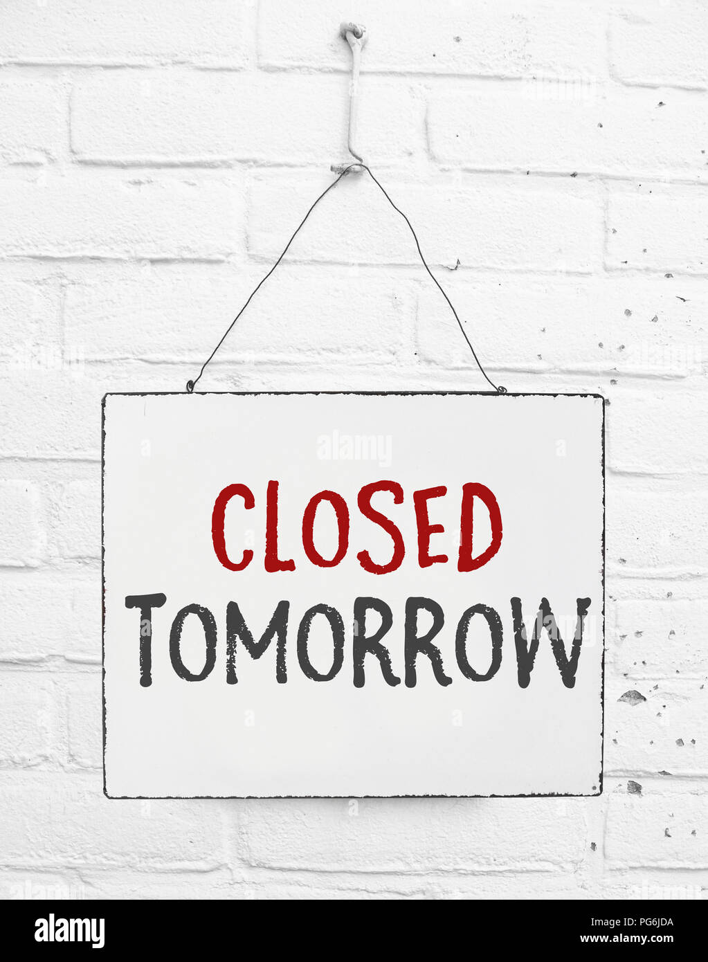 Text board closed tomorrow banner not open sign for store Stock Photo