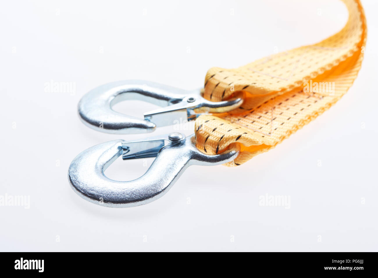 close up view of yellow car tow rope isolated on white Stock Photo