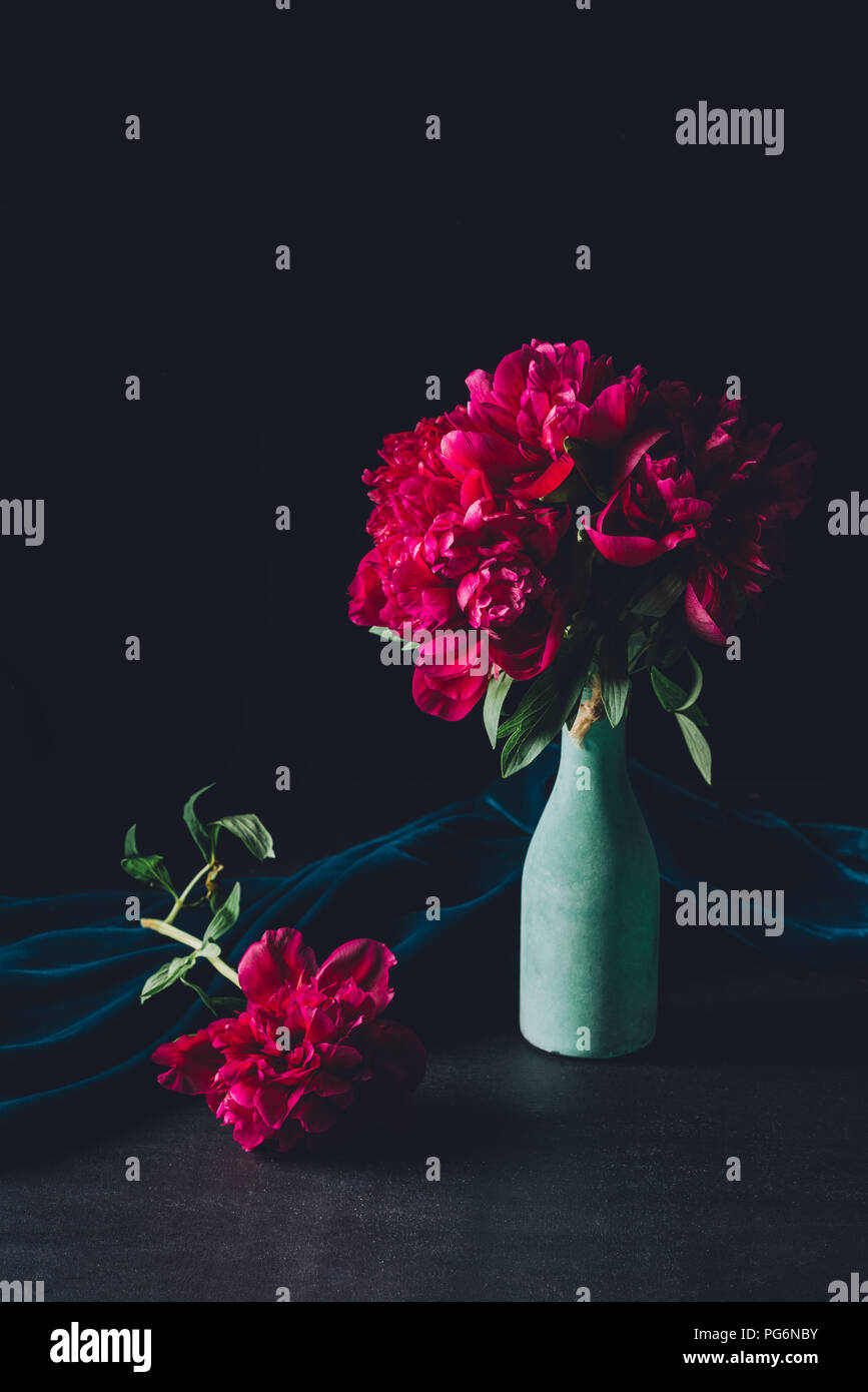 festive bouquet of pink peonies in vase on dark background Stock Photo ...