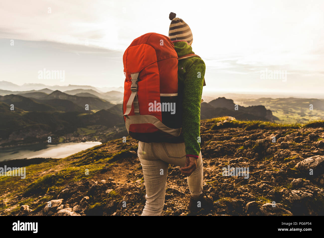 Austria, Salzkammergut, Hiker with backpack hiking in the Alps Stock Photo