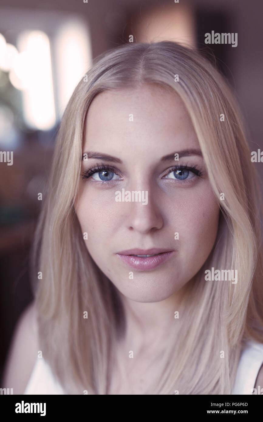 Portrait of young blond woman with blue eyes Stock Photo