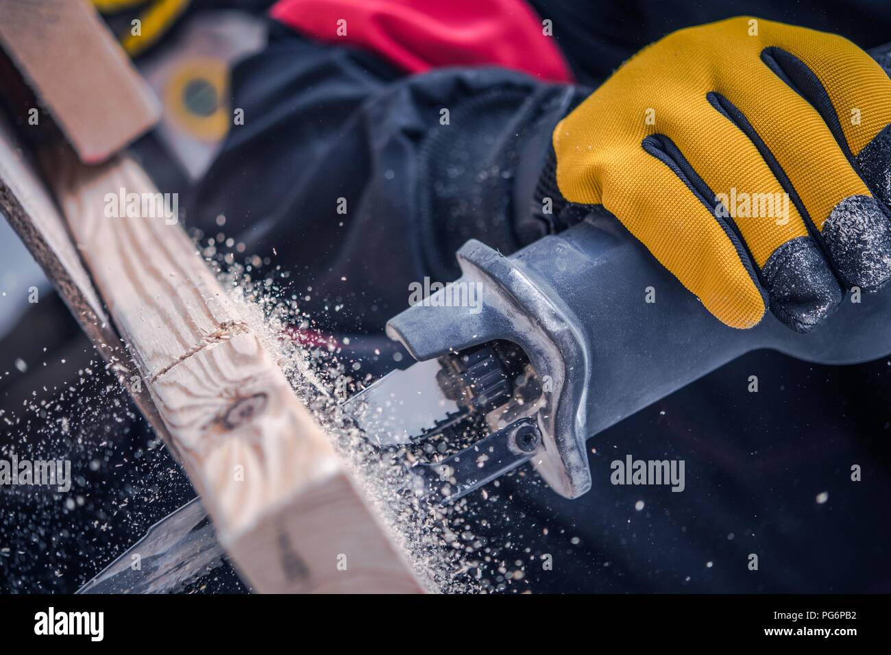 Reciprocating Saw Closeup Photo. Power Tool Wood Cutting. Construction Industry. Stock Photo