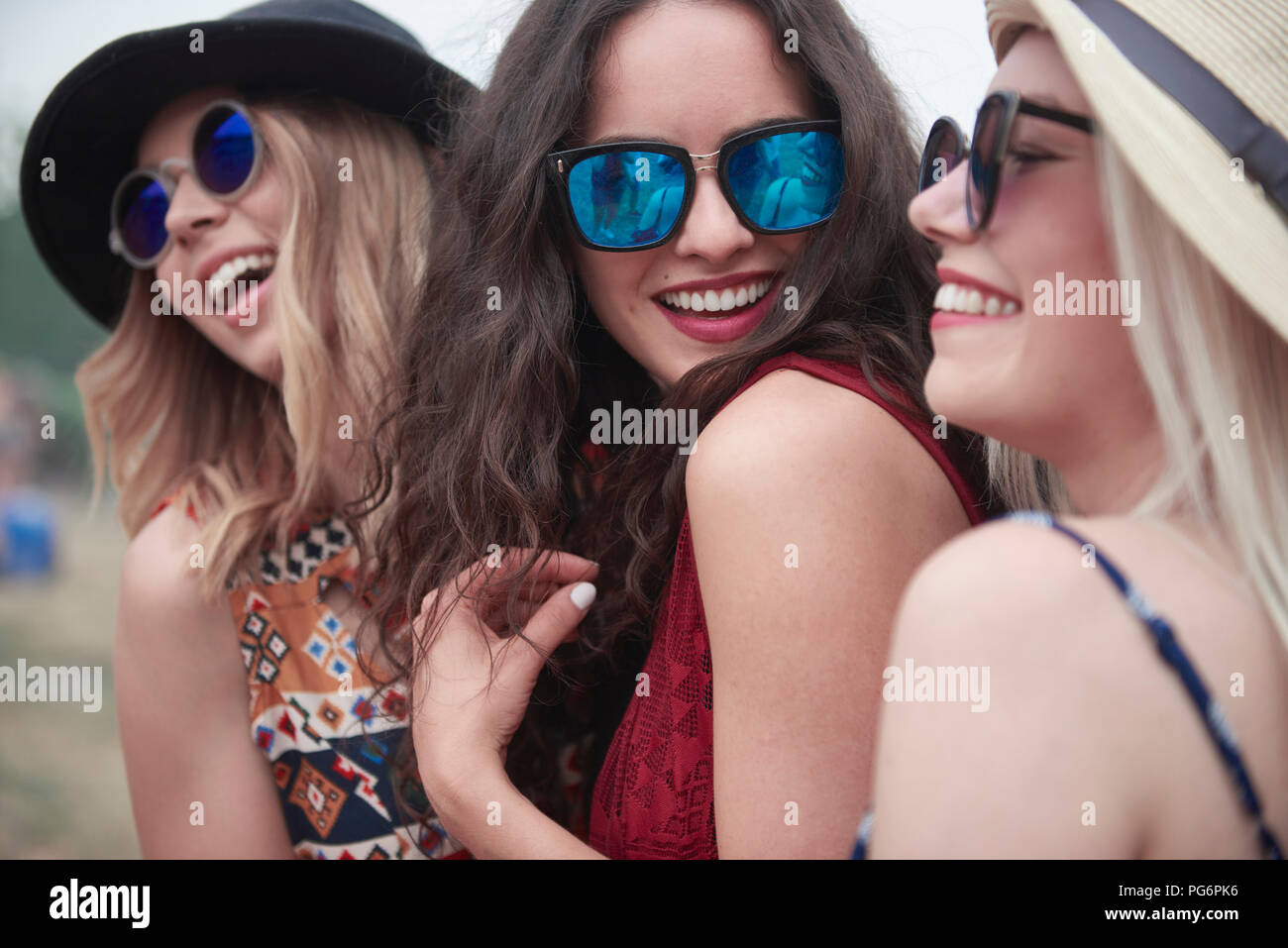 Three women dancing at the music festival Stock Photo