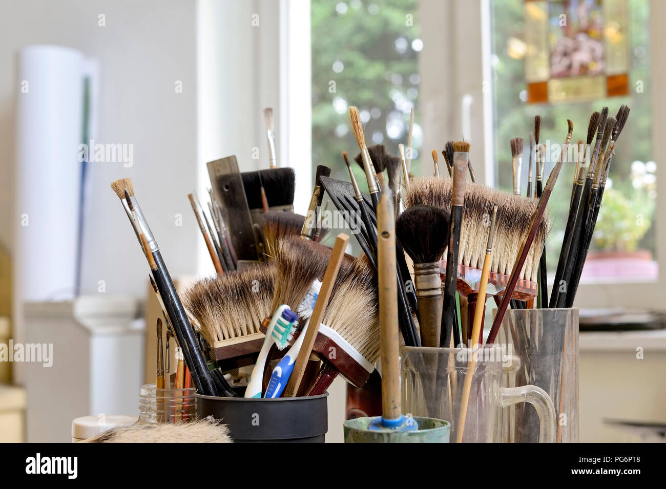 Assortment of brushes in a workshop Stock Photo