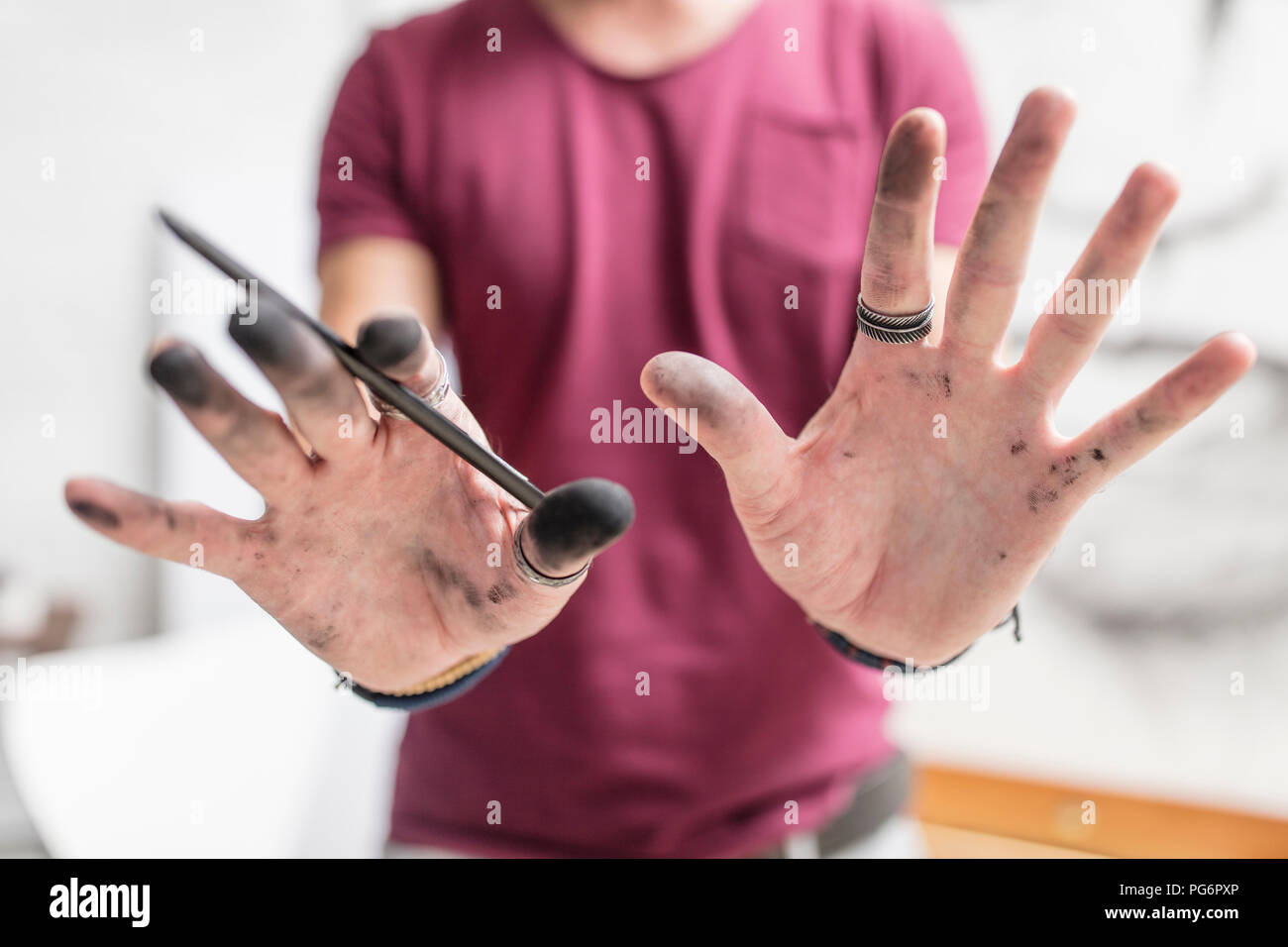 Artist showing his dirty hands Stock Photo