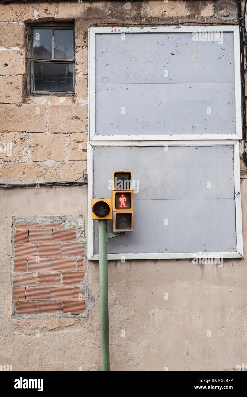 Spain, Mallorca, Traffic light in front of run down house Stock Photo