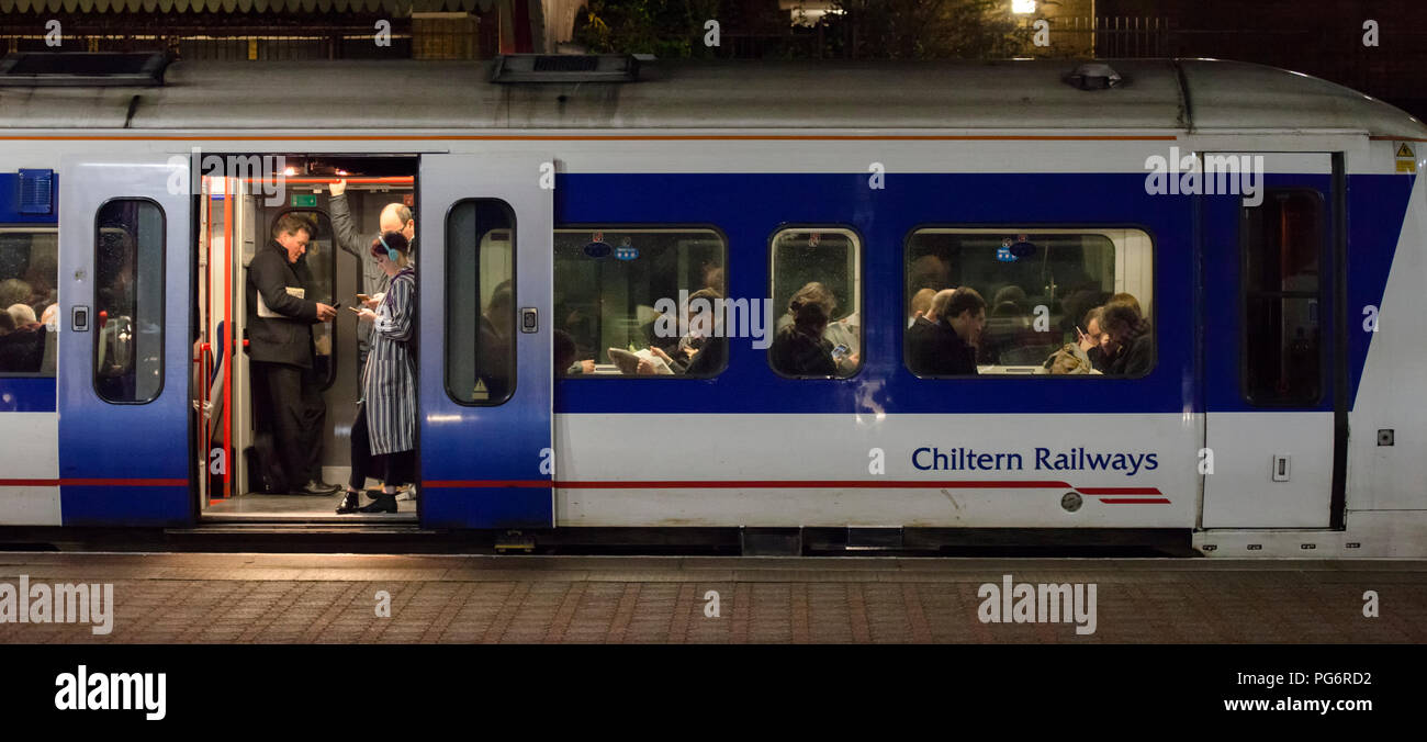 Rail commuters on a Chiltern railways train at London Marylebone in the evening rush hour Stock Photo