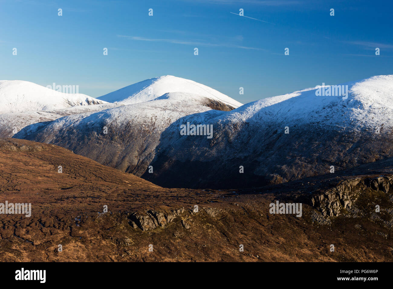 Snowcapped Mourne Mountains. Slieve Donard, N.Ireland's highest mountain, is seen in the distance centrally, Slieve Lamagan on right. Stock Photo