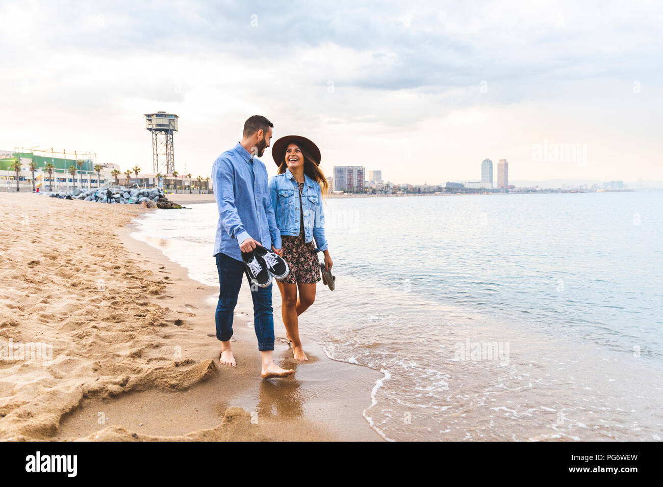 Walking barefoot on the beach hi-res stock photography and images - Alamy