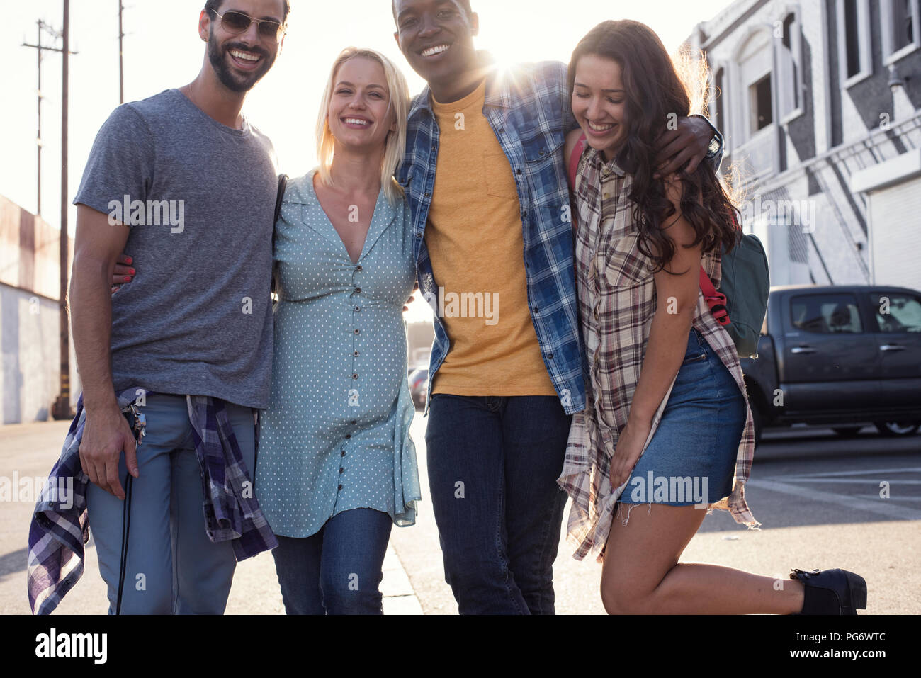 Two happy young couples outdoors on the go Stock Photo