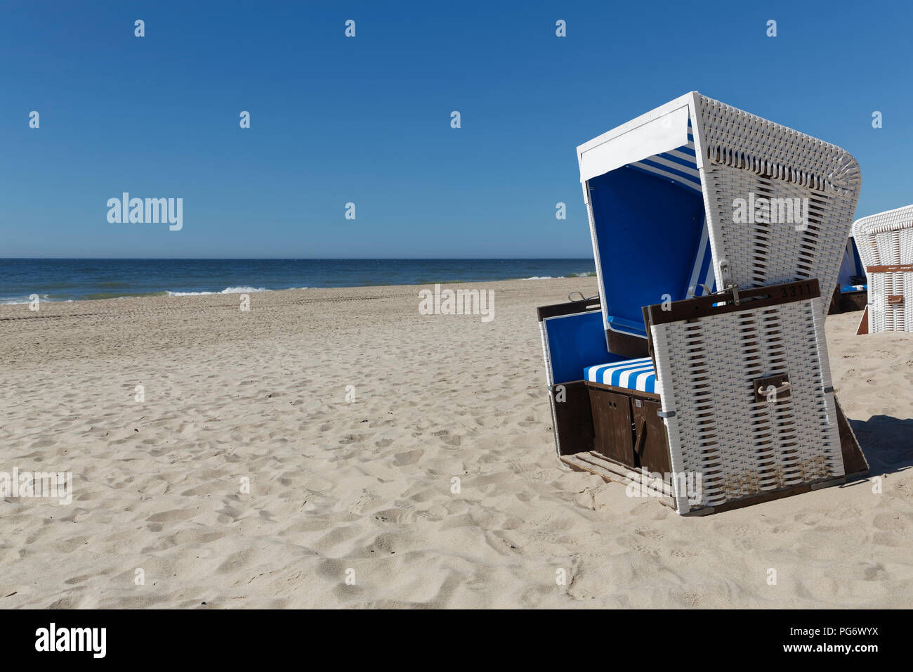 Germany, North Frisia, Sylt, Hooded beach chair at Rantum beach Stock Photo
