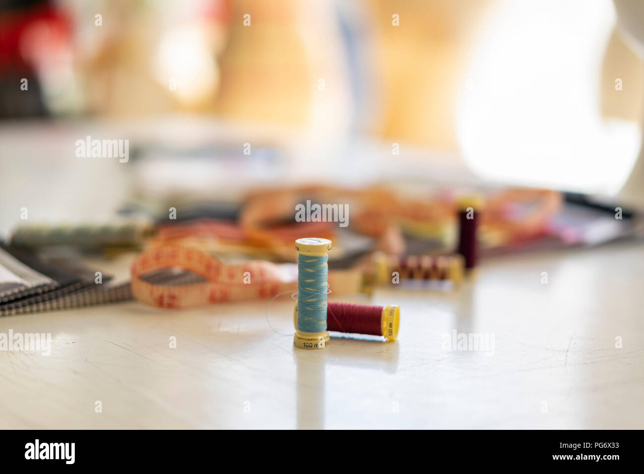 Sewing items on working table in a fashion designer's studio Stock Photo