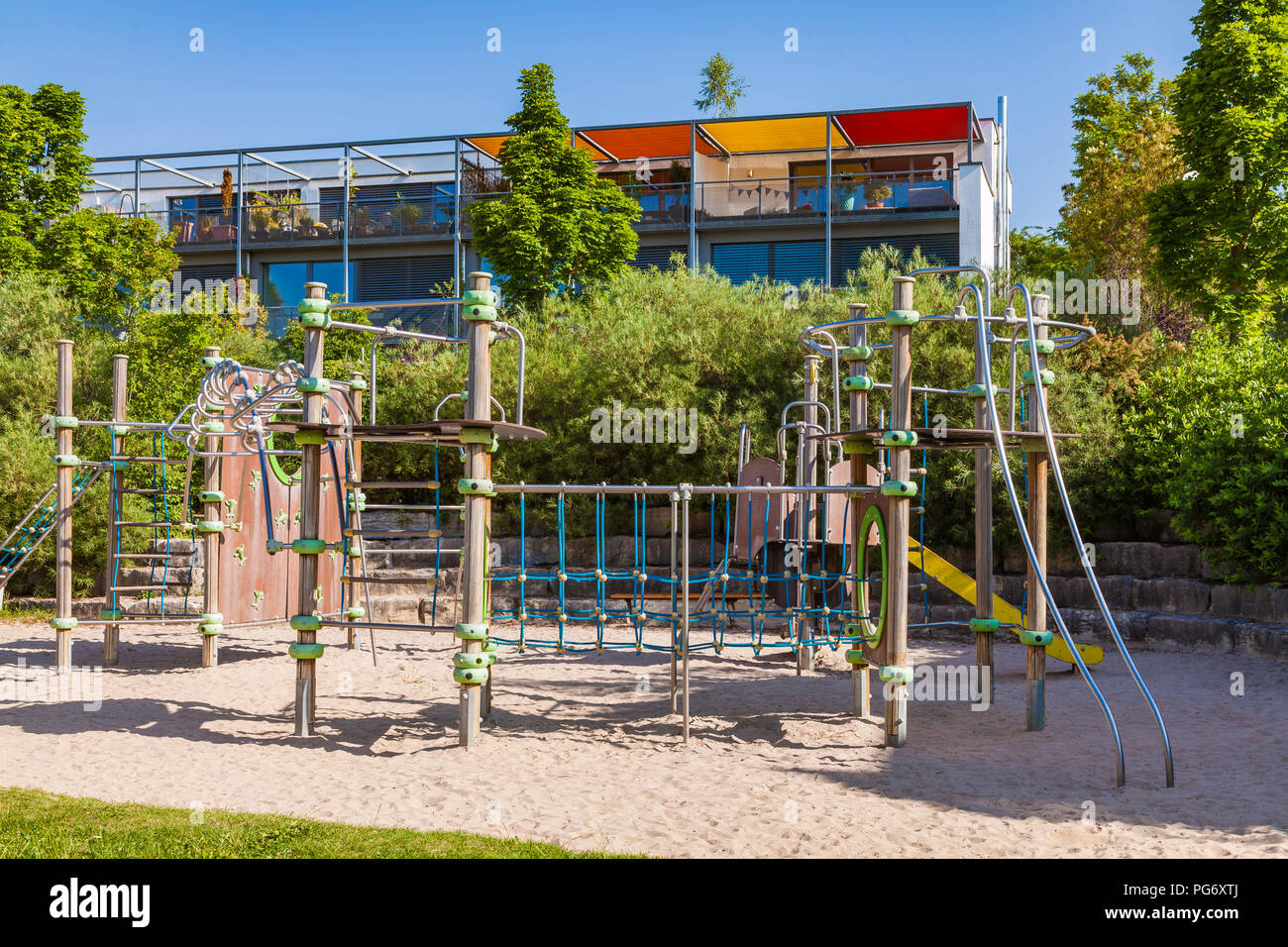Germany, Baden-Wuerttemberg, Ulm, Eselsberg, Passive house, play ground in the foreground Stock Photo