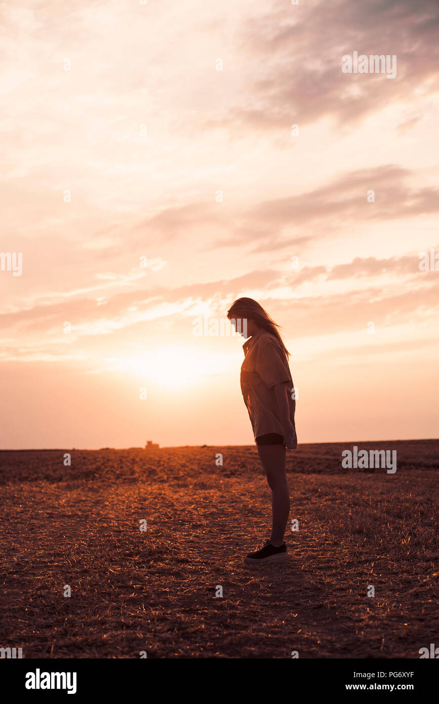 Lonely young woman standing hi-res stock photography and images - Alamy