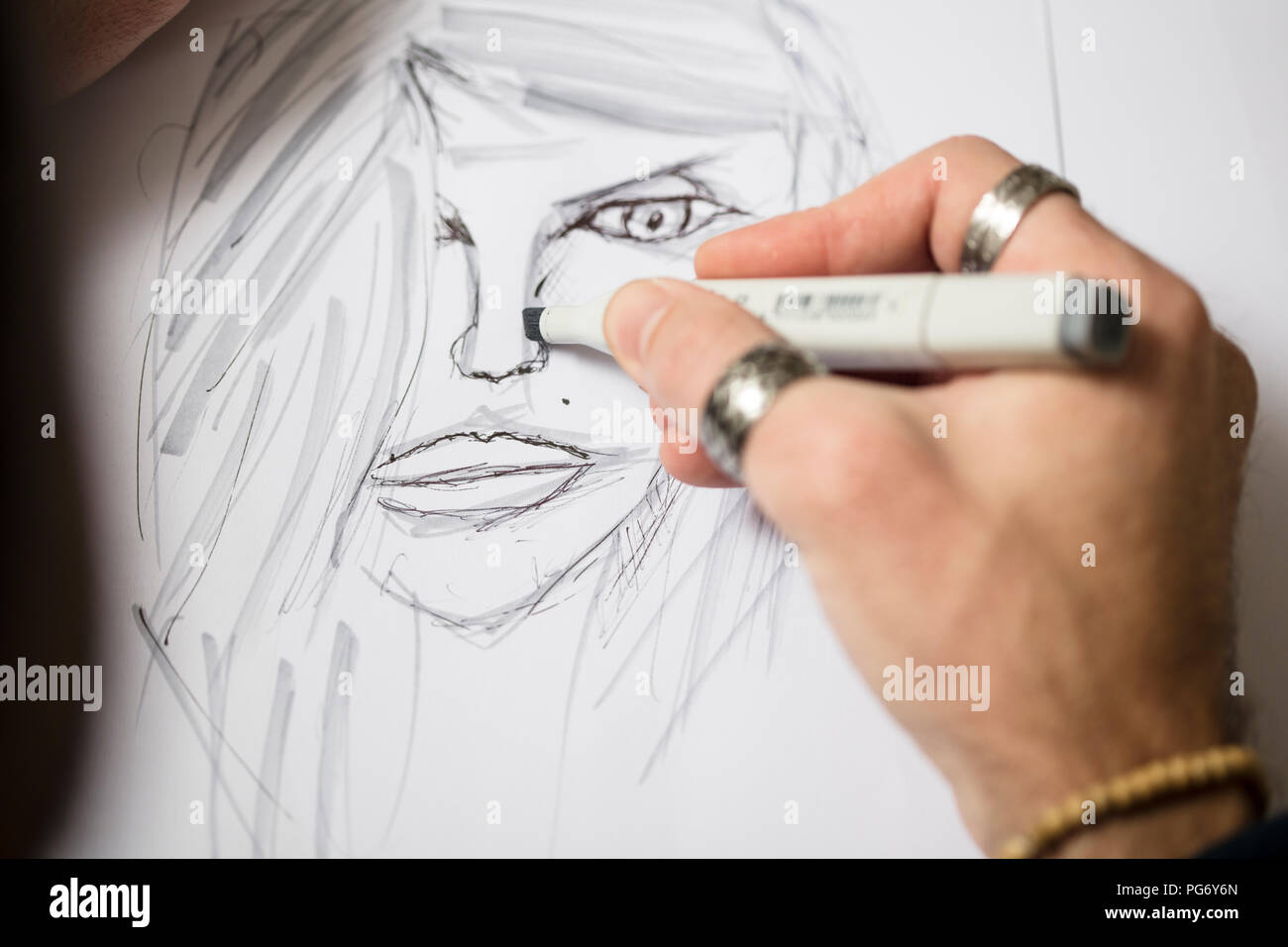 Close-up of artist drawing a sketch Stock Photo
