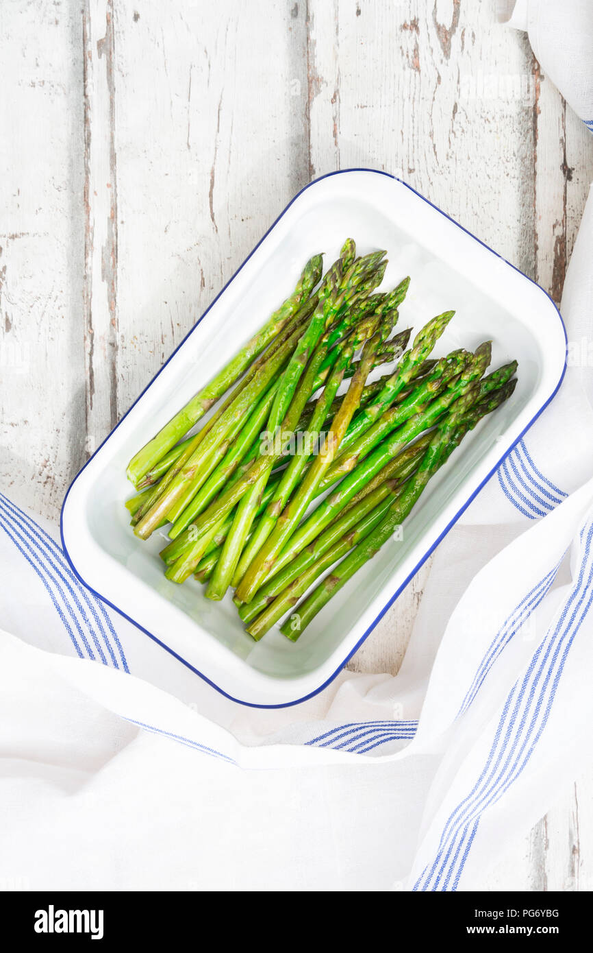 Boiled organic green asparagus in souffle dish Stock Photo Alamy