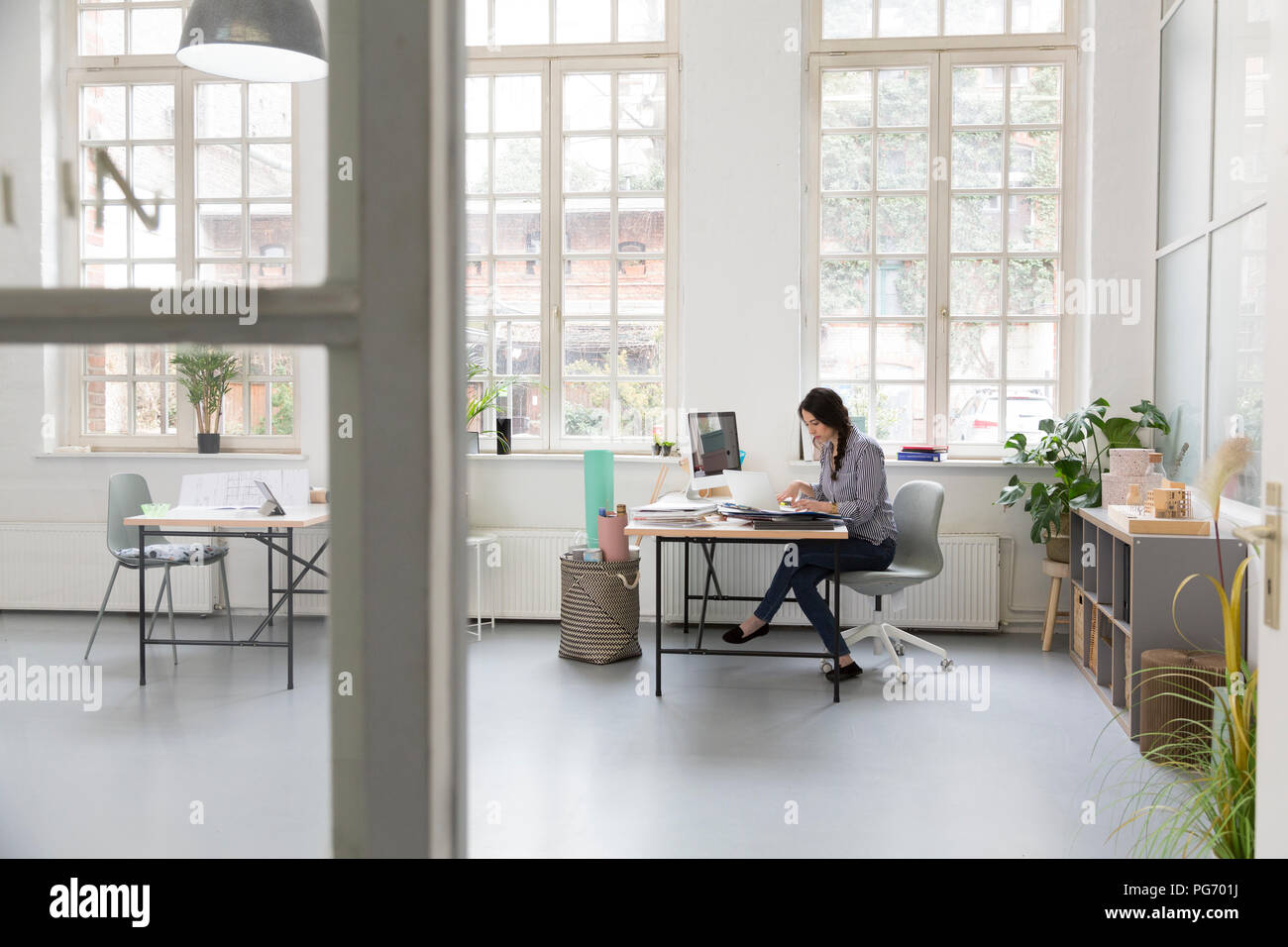 Woman working desk loft office hi-res stock photography and images - Alamy