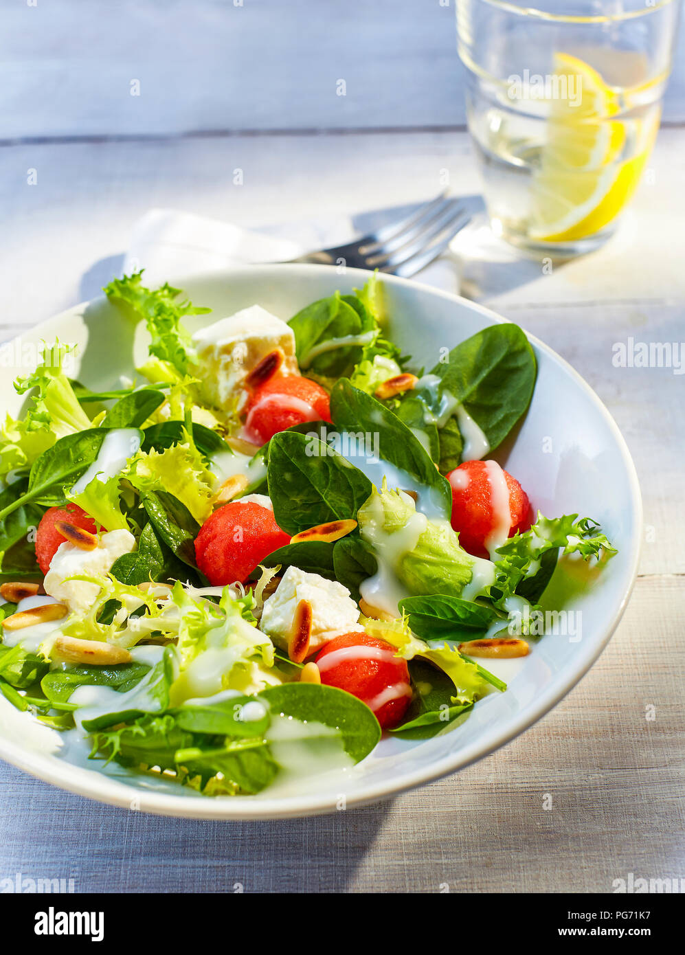 Mixed salad with water melon and roasted pine nuts Stock Photo