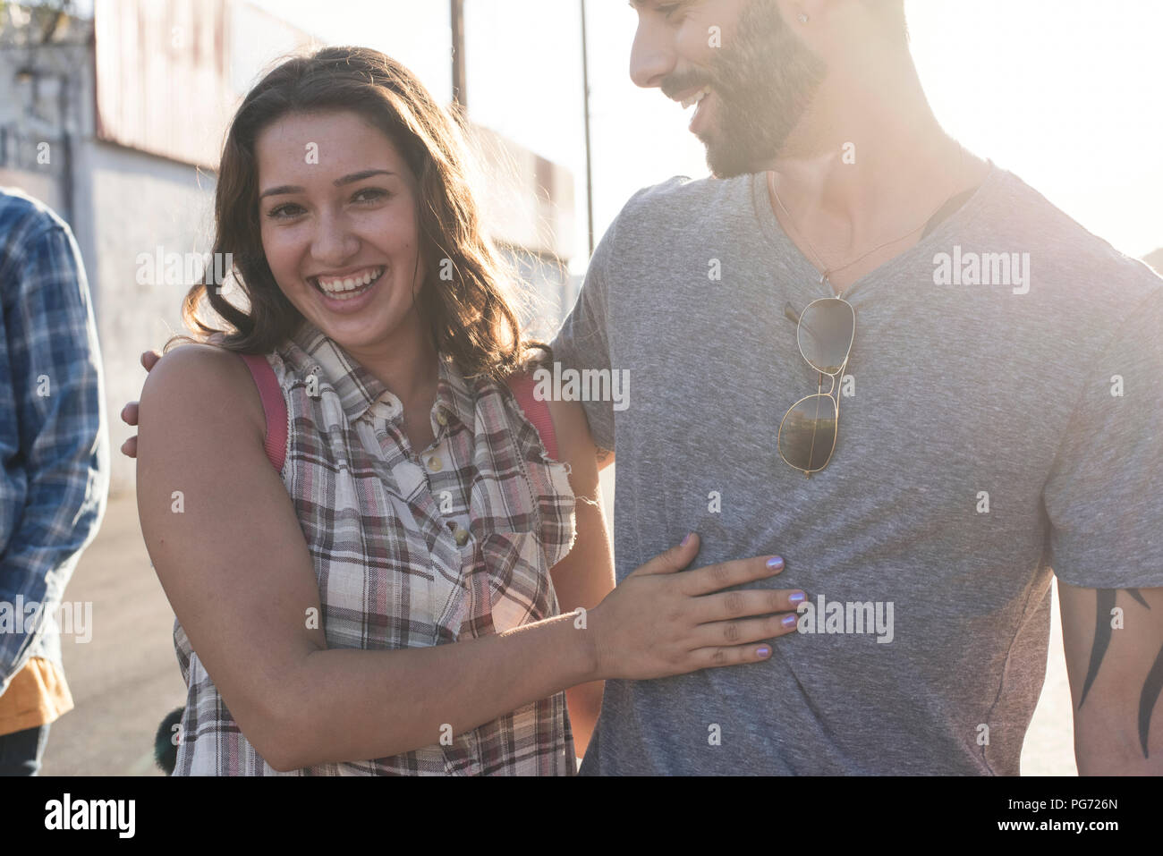 Joyful young couple embracing hi-res stock photography and images - Alamy