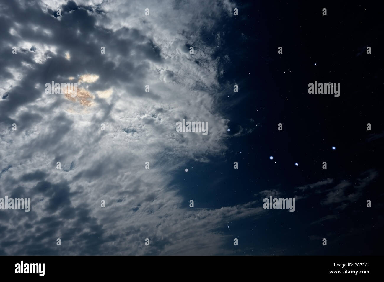 Beautiful cloudy full moon night with stars Stock Photo - Alamy