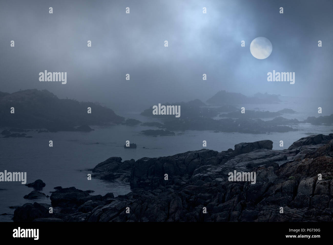 Rocky sea coast in a foggy full moon night. Were used some digital ...
