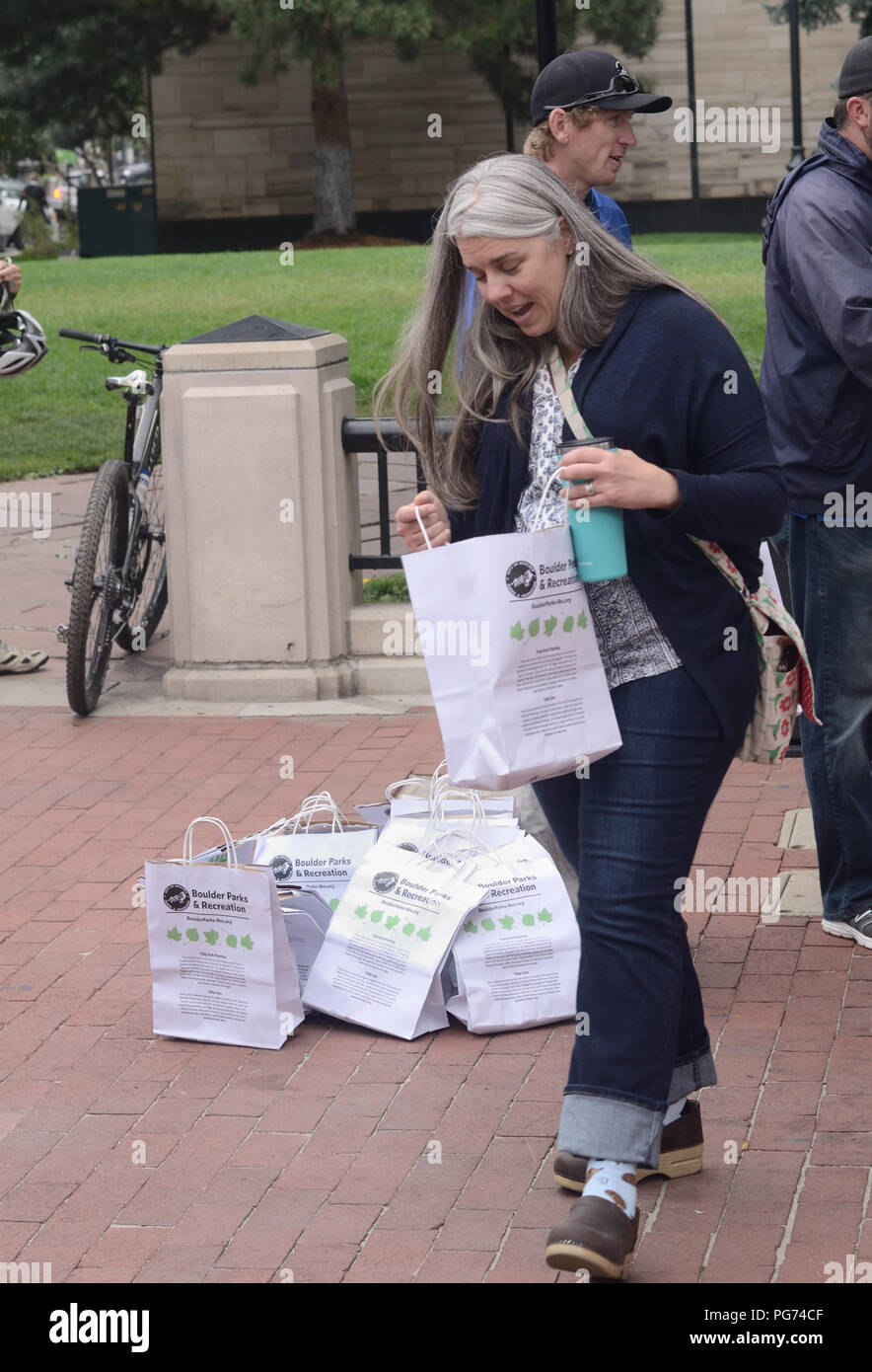 A woman looks into her bag of tulip bulbs during the Boulder bulb giveaway. Stock Photo