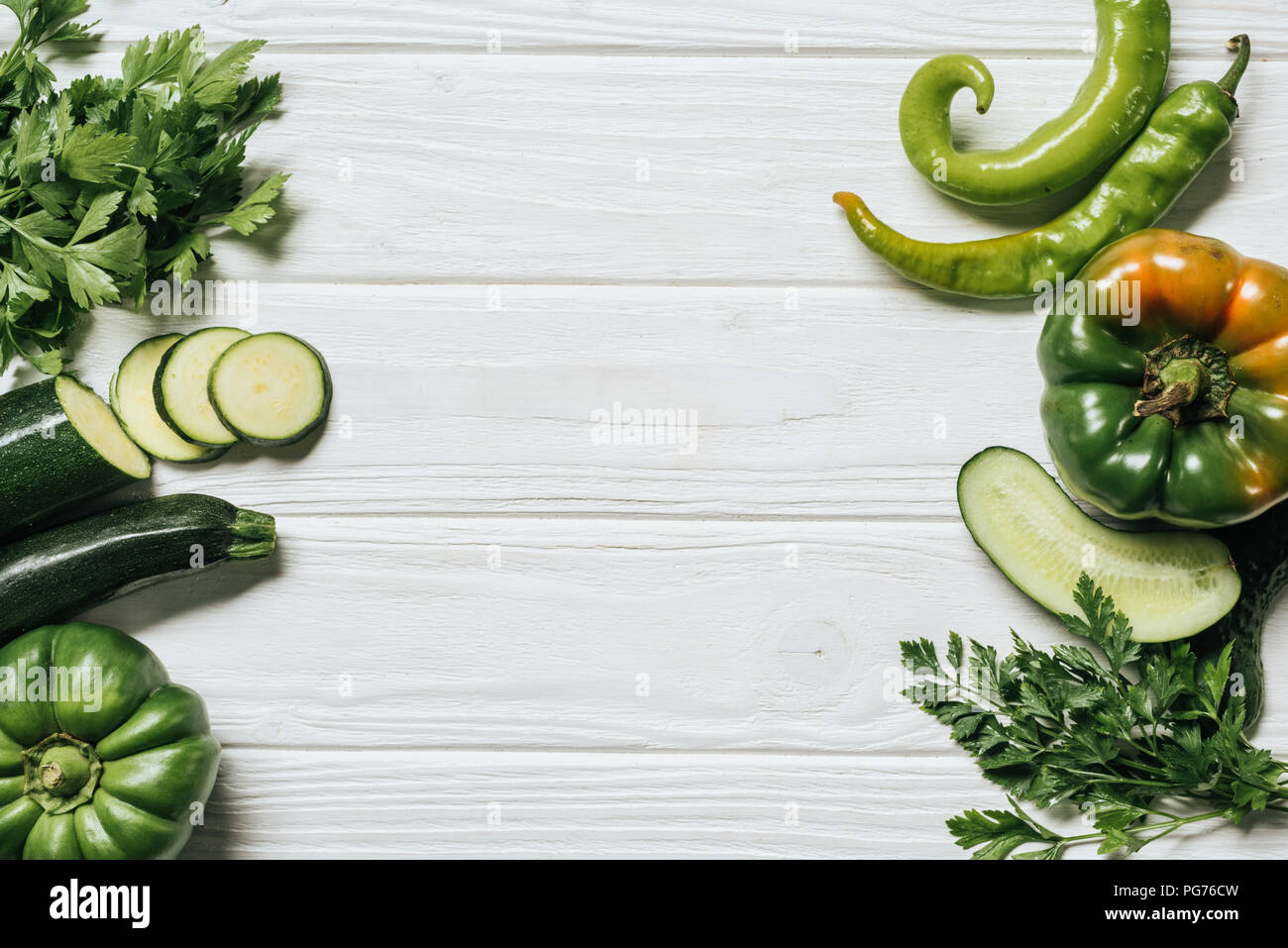 top view of green ripe vegetables on white wooden table Stock Photo - Alamy