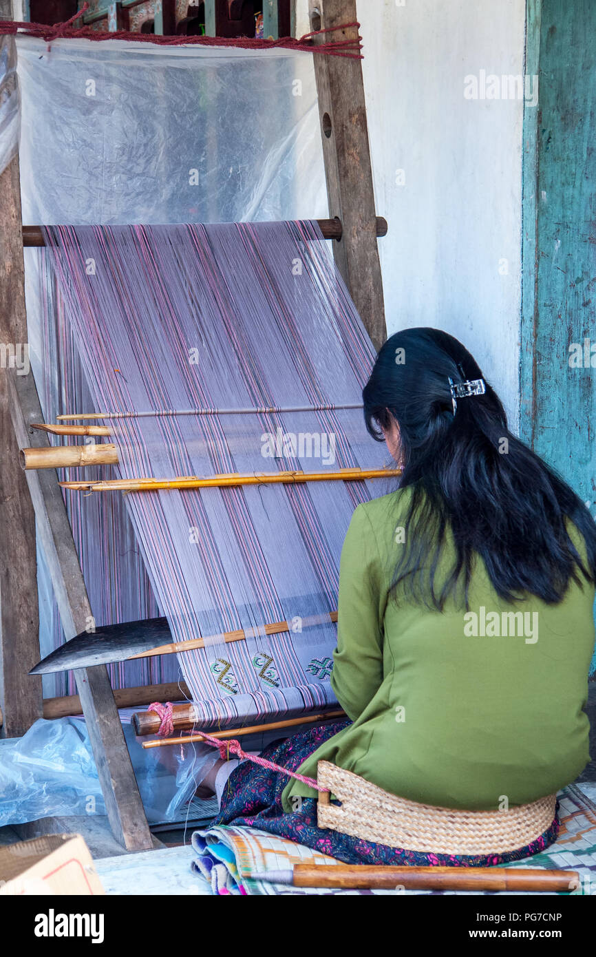 Bhutanese woman weaving - Eastern Bhutan Stock Photo