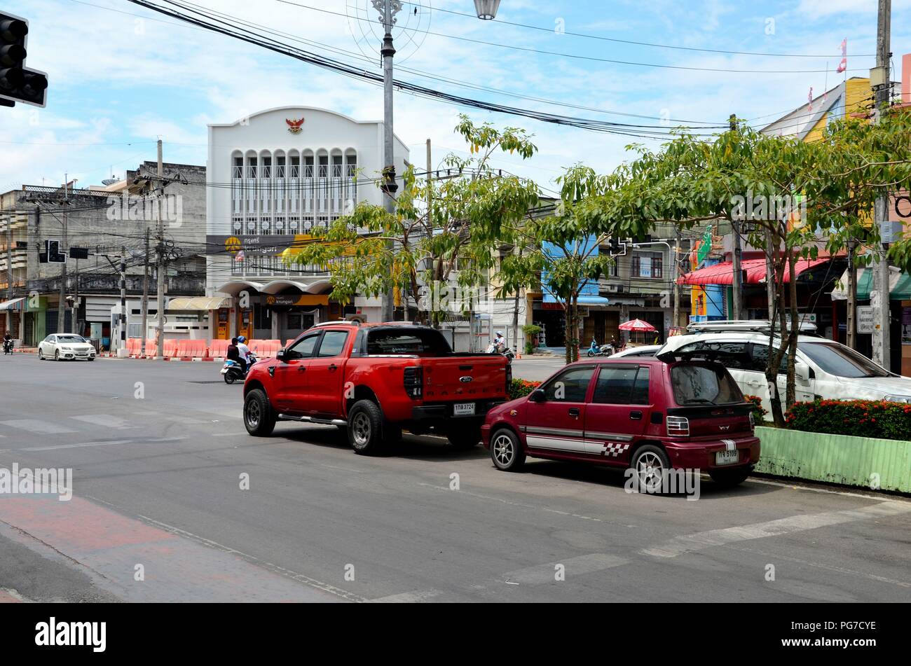 Cars and SUVs parked on main street of Pattani town Thailand Stock ...