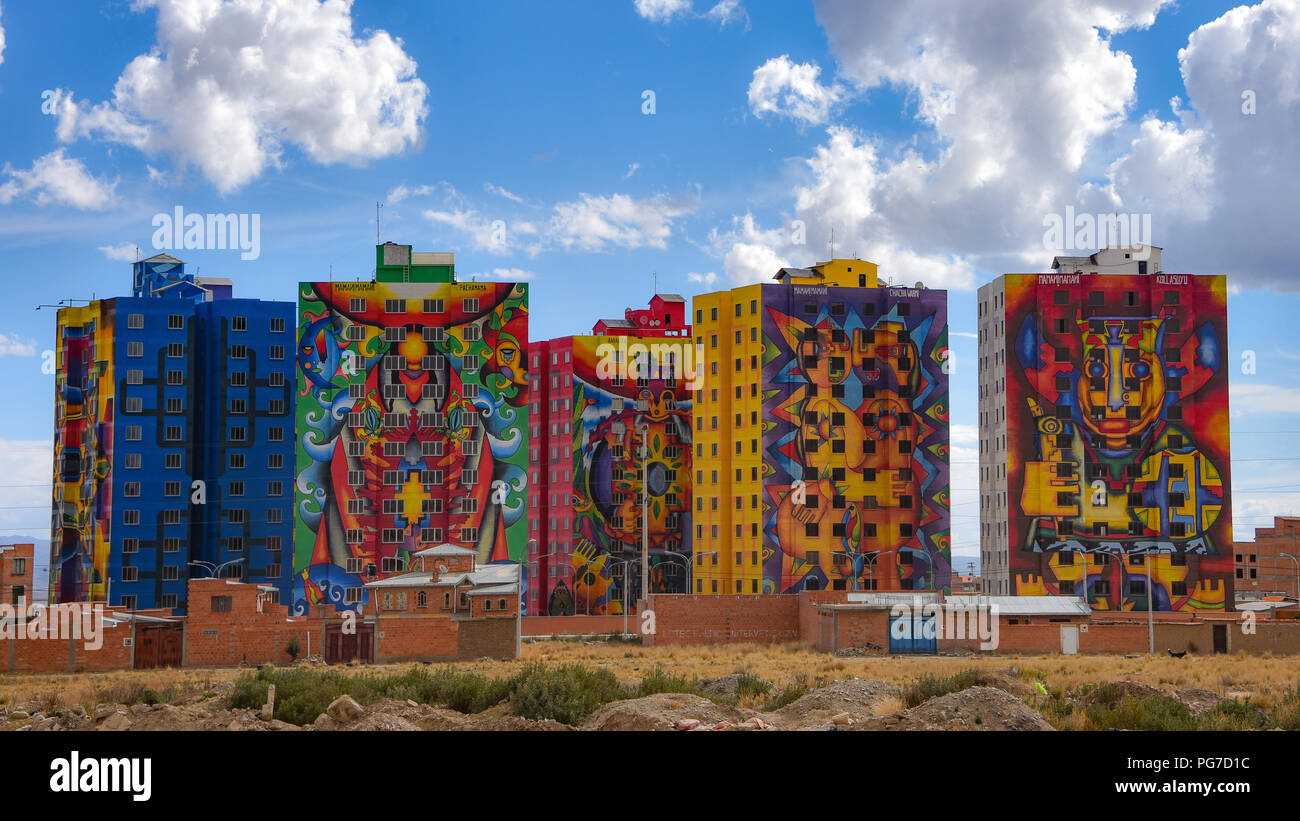 Brightly colored murals painted by Bolivian artist Roberto Mamani Mamani onto  condominium buildings in El Alto, La Paz, Bolivia Stock Photo