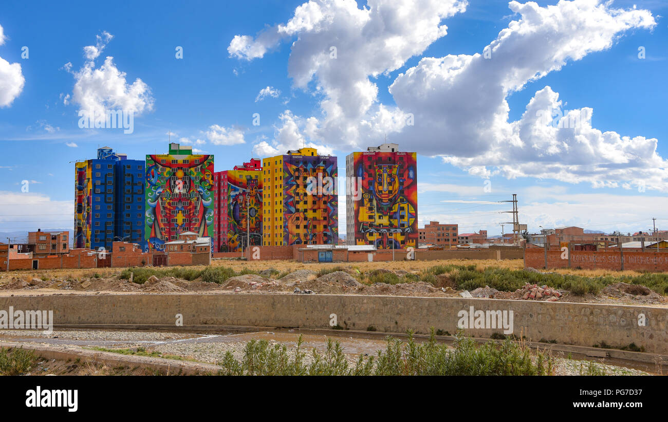 Brightly colored murals painted by Bolivian artist Roberto Mamani Mamani onto  condominium buildings in El Alto, La Paz, Bolivia Stock Photo
