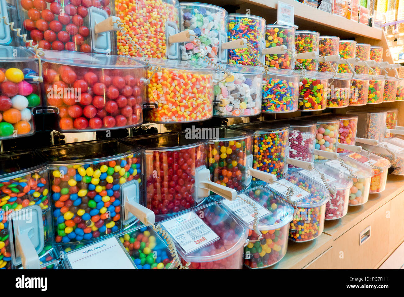Selection of various candy in dispensers in candy store - USA Stock Photo