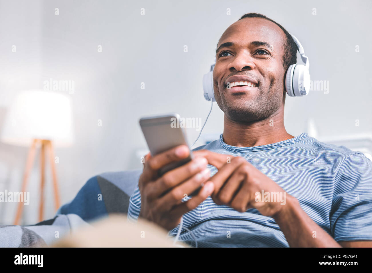 Cheerful man enjoying the music Stock Photo