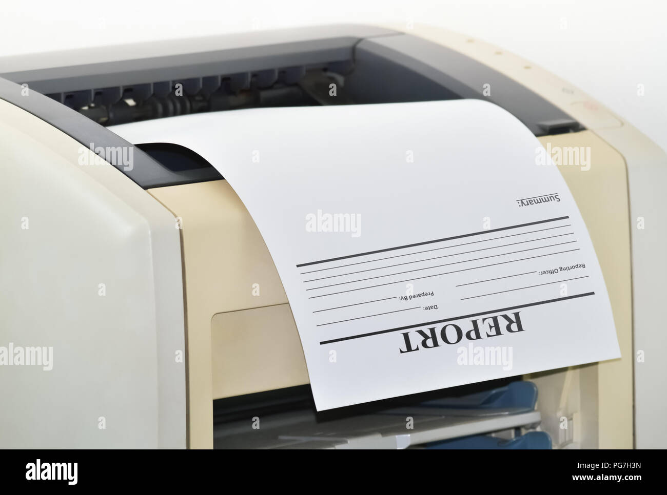 Closeup of a printer and a printed report in the office Stock Photo