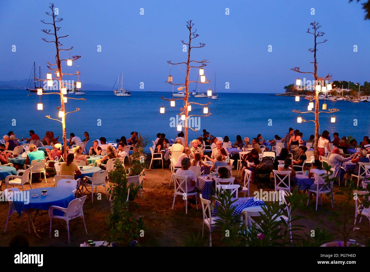People enjoying twilight time near the beach in Datca.Datca is a port town in southwestern Turkey. Stock Photo