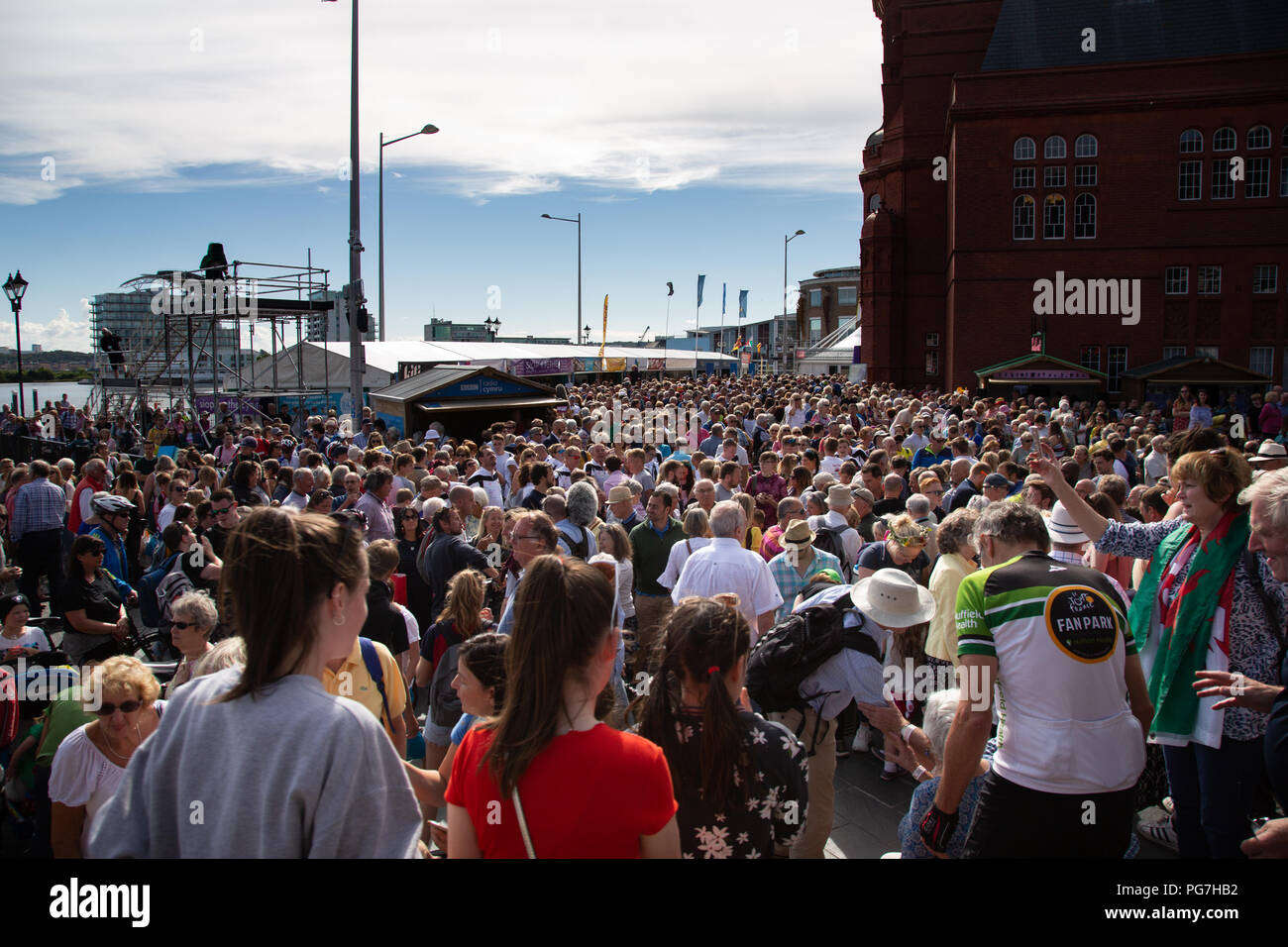 Part of a very large crowd outside the Senedd in Cardiff Bay welcoming Geraint Thomas, winner of the 2018 Tour de France. Stock Photo