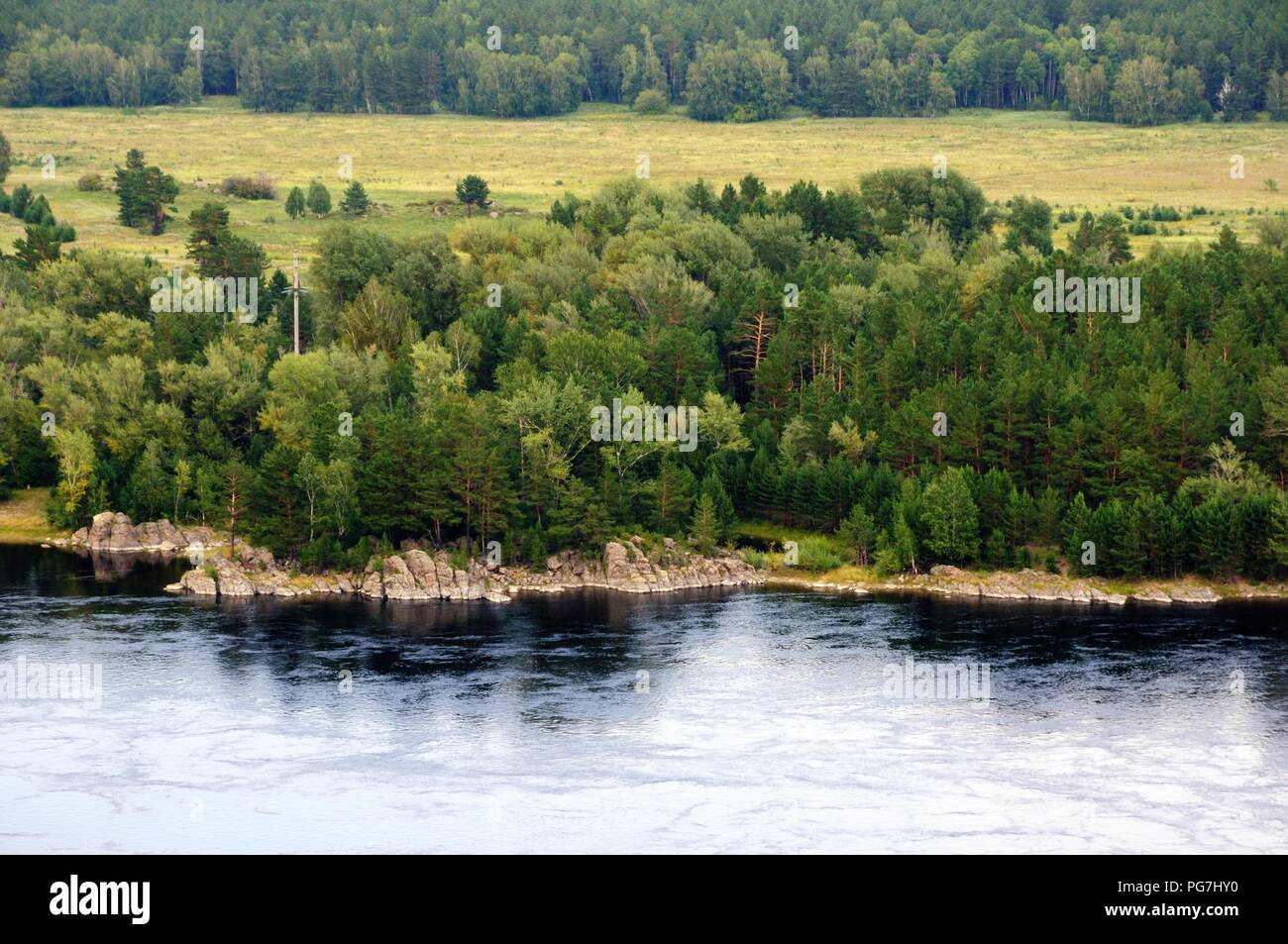 Rocky bank of the Yenisey river near the town of Sayanogorsk, Khakassia, Russia. Stock Photo