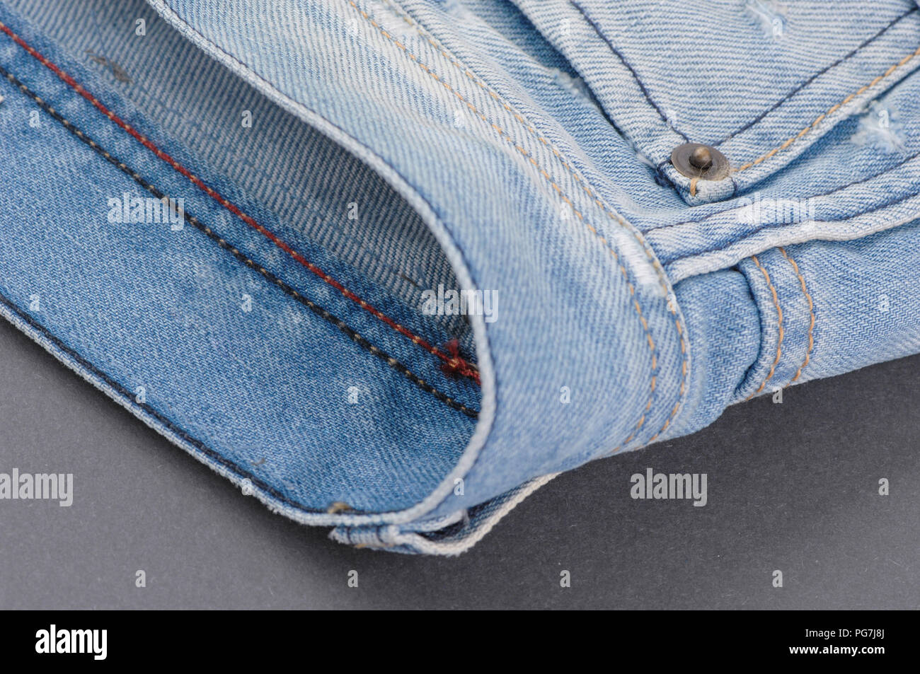 part of the blue denim pants with pockets and rivets, closeup Stock