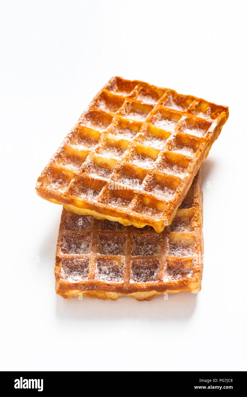 Food concept Classic square Waffles with icing sugat toping on white background Stock Photo