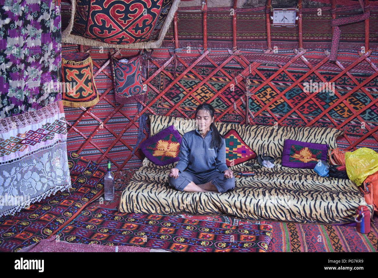 Meditating in a Kyrgyz yurt, Kara Jilga, Tajikistan Stock Photo