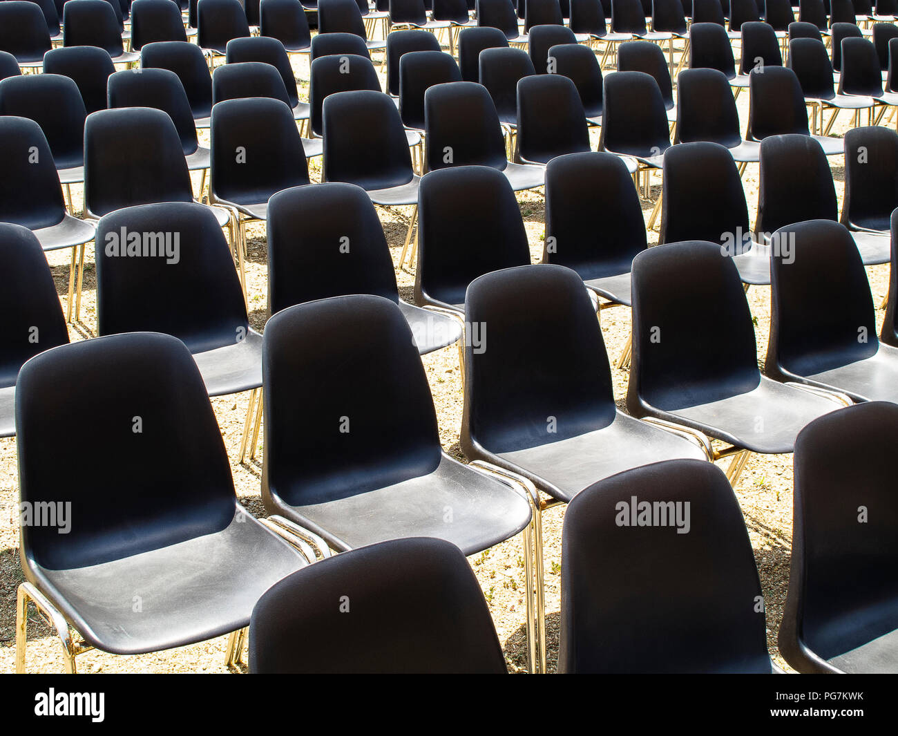 Calabria (Italy): the metal legs of plastic chairs, seen from abowe, placed in an outdoor theater waiting for the public Stock Photo