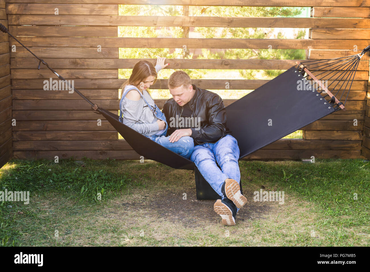 Love and family concept - Man hugging his pregnant wife Stock Photo - Alamy