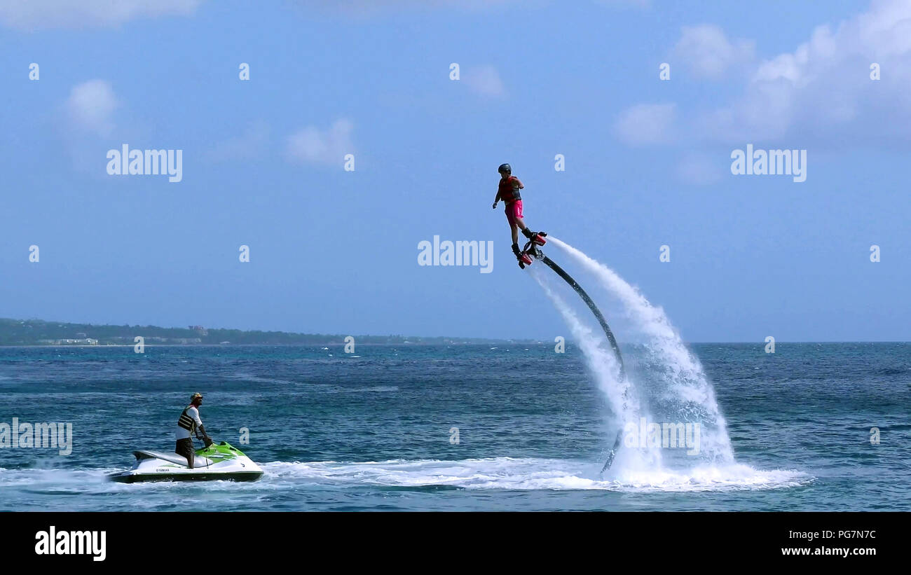 Man flying on Jetpack boots Stock Photo