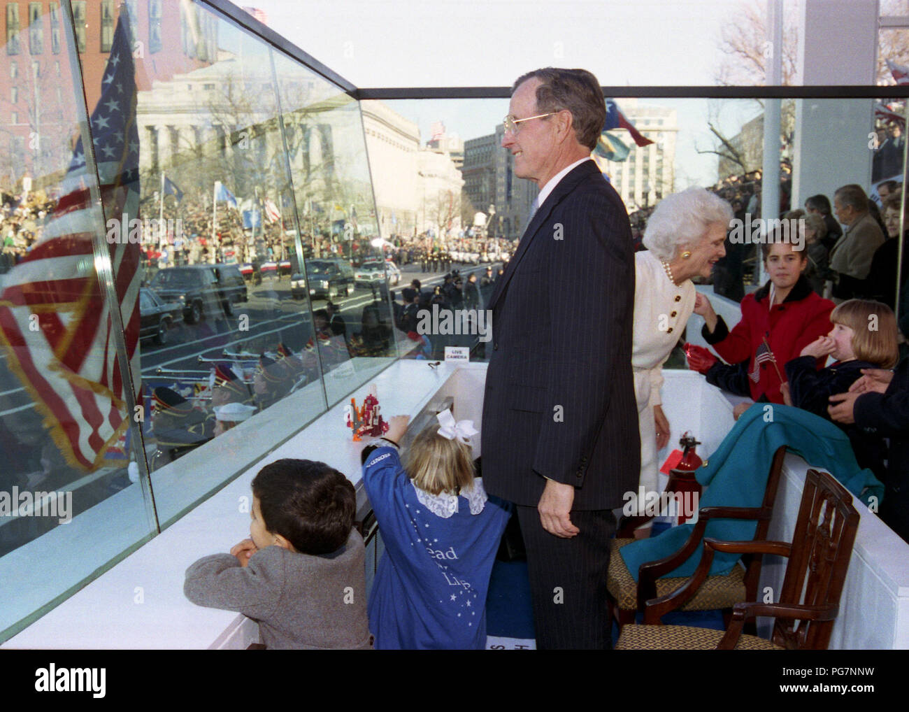 President Bush Watches the Inaugural Parade from the Reviewing Stand with Various Members of His Family 1 20 1989 Stock Photo
